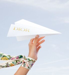 woman at desk working girl boss personal branding dior
