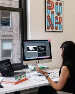 woman at desk working girl boss personal branding