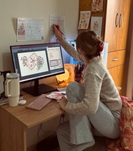 woman at desk working girl boss personal branding