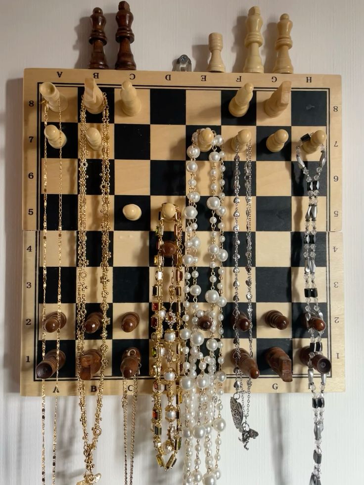 Organize your jewelry with thrifted items and hang them on the wall like home decor with this fun DIY craft at ArtsyDrawings.com